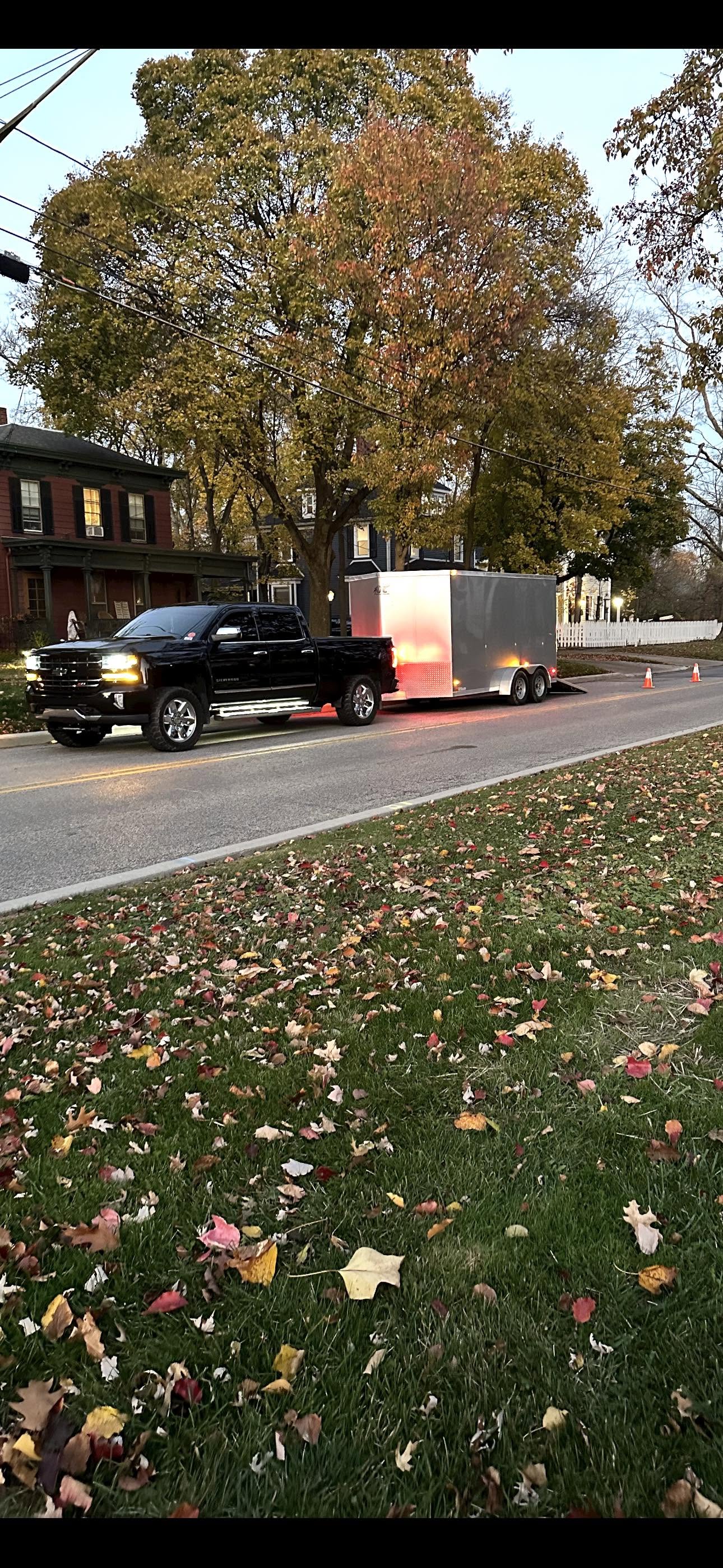 Pickup truck hauling an enclosed equipment trailer