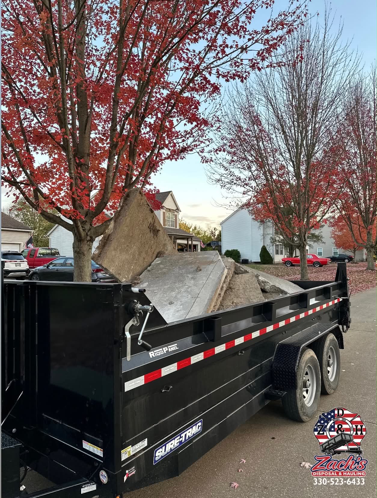 Dump trailer loaded with broken concrete slabs for removal