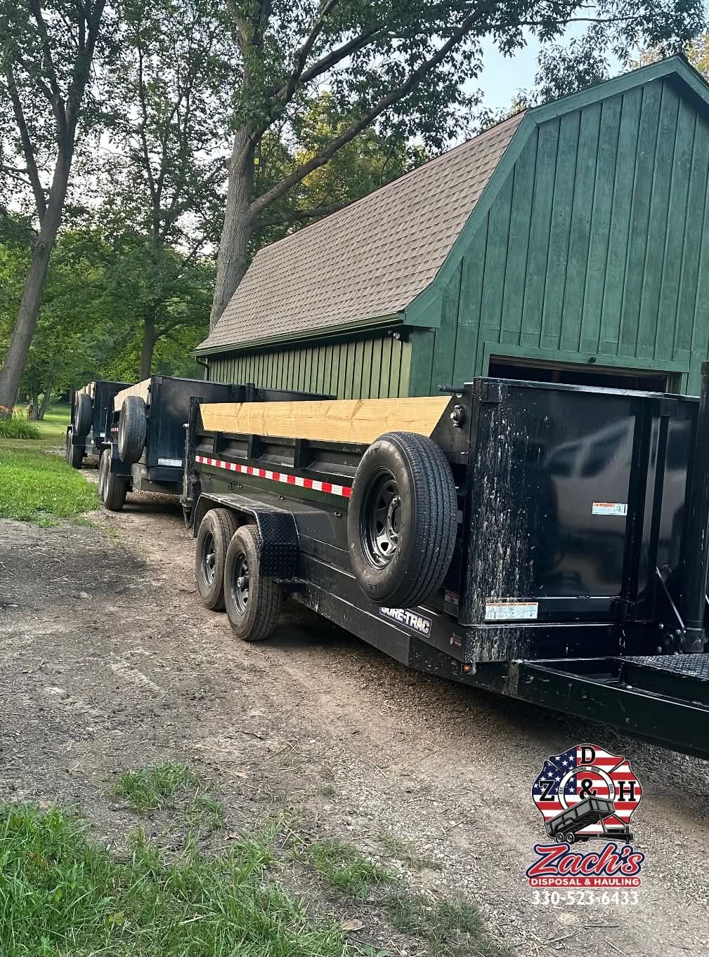 Two driveway-safe dump trailers ready for customer delivery